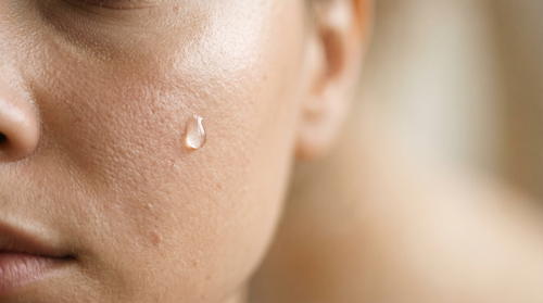 Editorial skincare product photograph — oily but dehydrated skin.