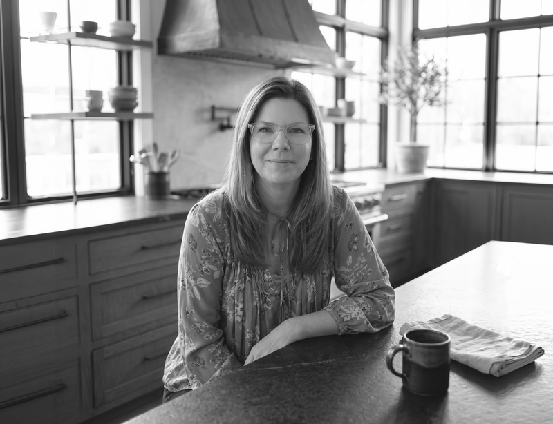 Kris, co-founder of Sorrel & Co, in her kitchen — black and white portrait
