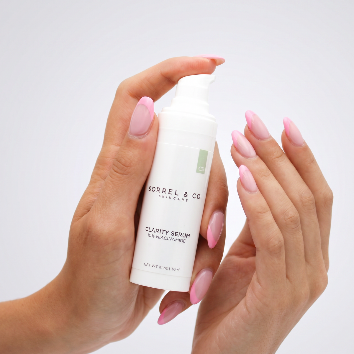 Clarity Serum with 10% Niacinamide held in hand
