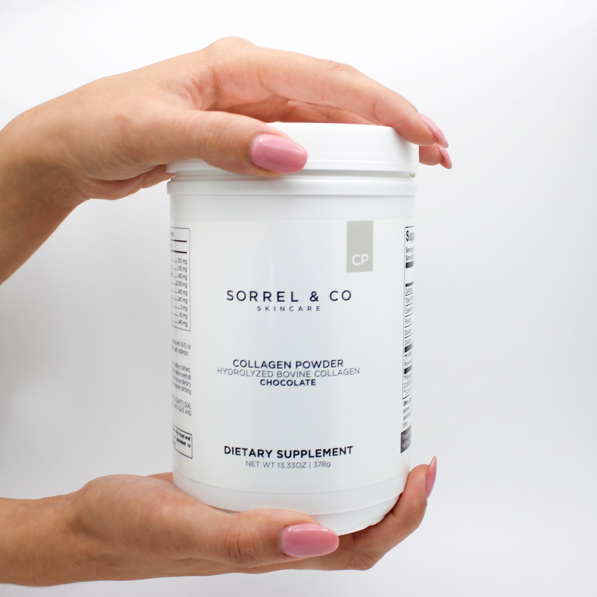 Collagen Powder with Hydrolyzed Bovine Collagen - Chocolate held in hand