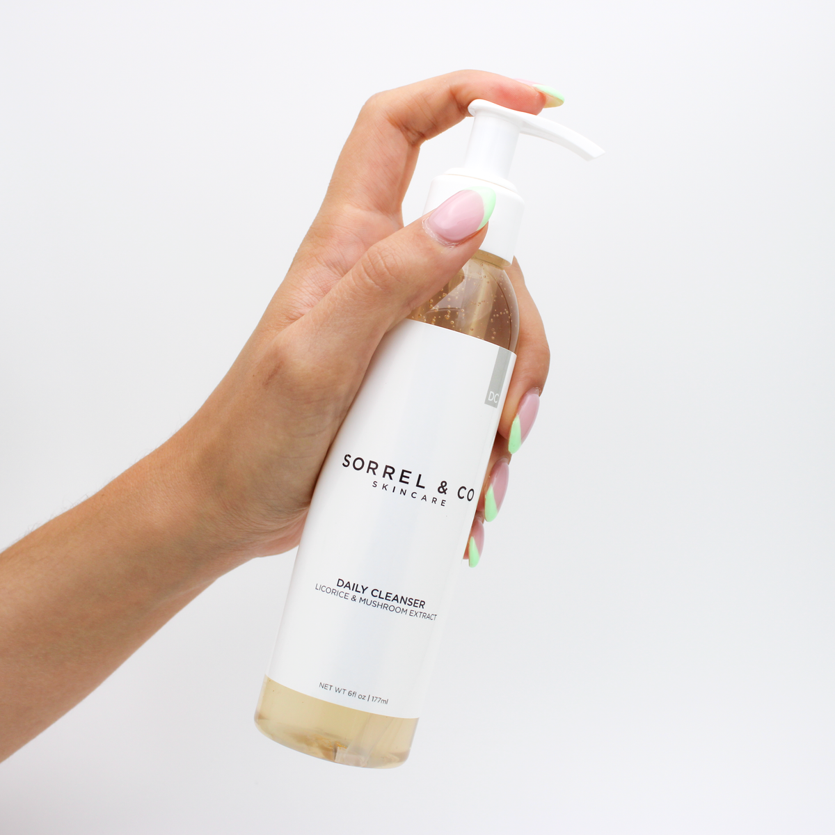 Daily Cleanser with Licorice & Mushroom Extract held in hand
