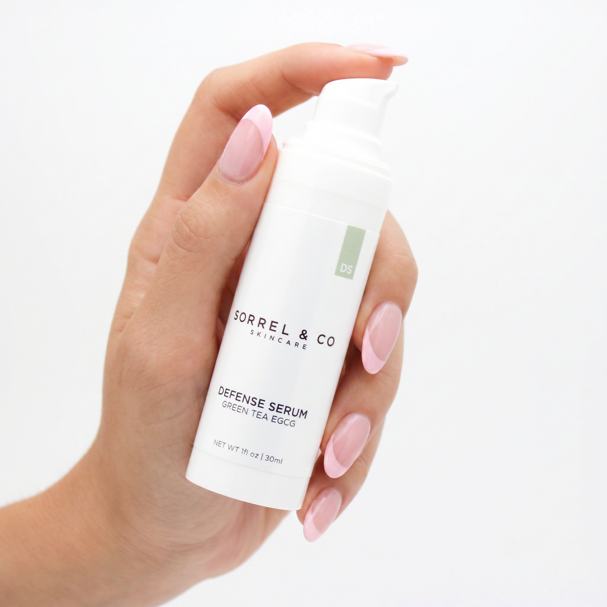 Defense Serum with Green Tea EGCG held in hand
