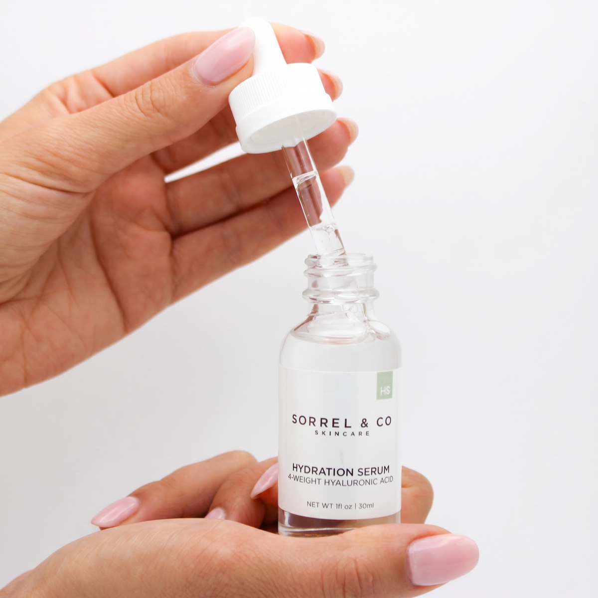 Hydration Serum with 4 Weight Hyaluronic Acid held in hand
